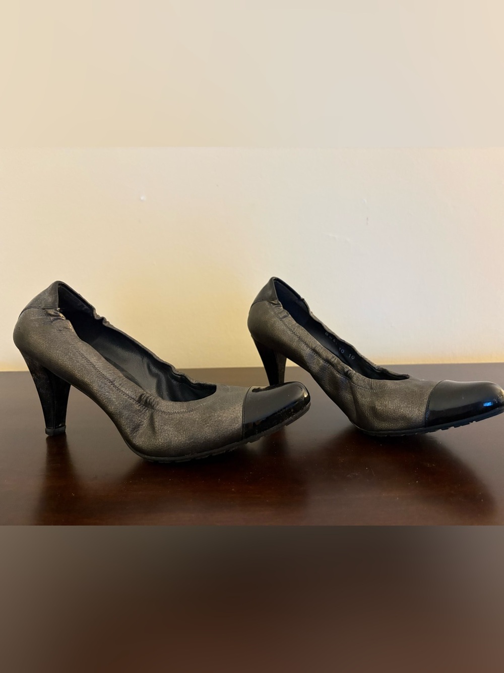 Stuart Weitzman Pewter Leather Pump, Black Patent cap-toe and heel. Stretch heel
